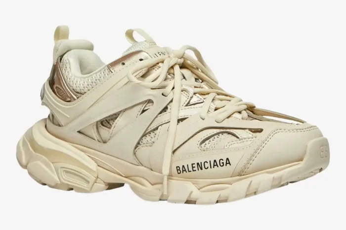 Balenciaga Track Sneaker in beige cream, side view showing layered design and logo. - SKU 542436W2LA29110