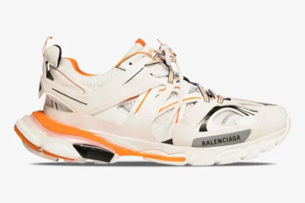 Balenciaga Track Sneaker in white, orange, and black, shown from a side profile view. - SKU 542023W1GB19059
