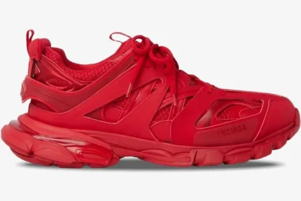 Side profile of a monochromatic red Balenciaga Track Trainer with layered mesh and nylon panels. - SKU 542023W2LA16000