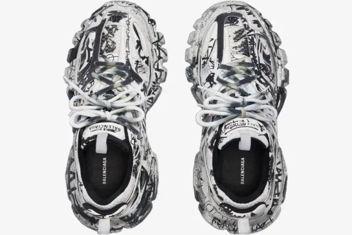 Top-down view of Balenciaga Track sneakers in white and black with an all-over graffiti print. - SKU 542023W3RRA9010