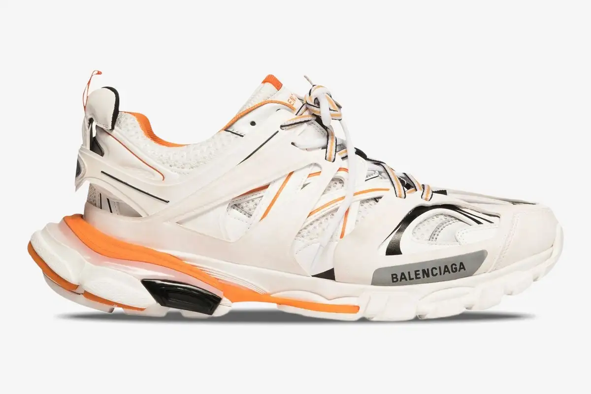 balenciaga-track-white-orange-side-view-542023w1gb19059-740-053 Balenciaga Track sneakers in white and orange, side profile view on a plain white background. - SKU 542023W1GB19059