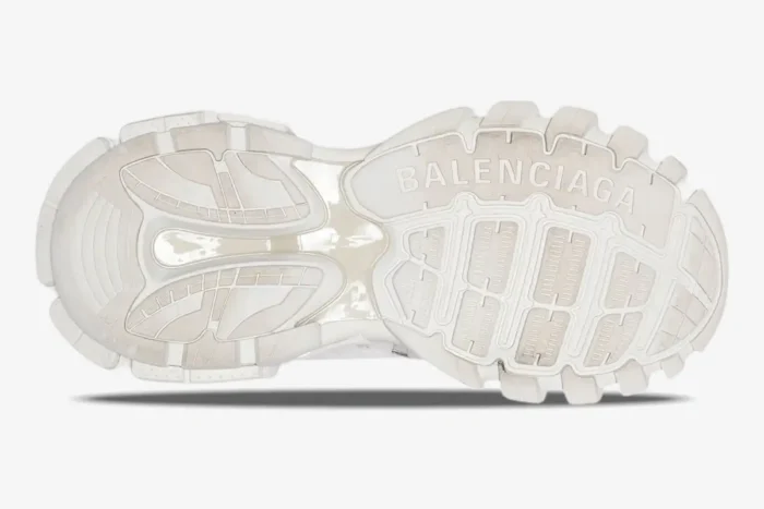 Bottom sole view of white Balenciaga Track multi-layered sneakers showing the tread and brand logo. - SKU 542023W1GB19000