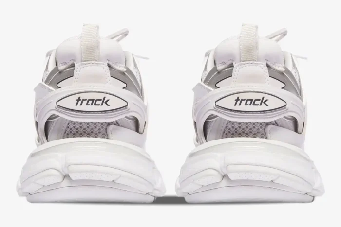 Rear view of white Balenciaga Track sneakers featuring multi-layered design and heel logo. - SKU 542023W1GB19000