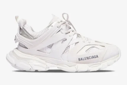 Side profile of Balenciaga Track white multi-layered sneakers with chunky soles and logo detail. - SKU 542023W1GB19000