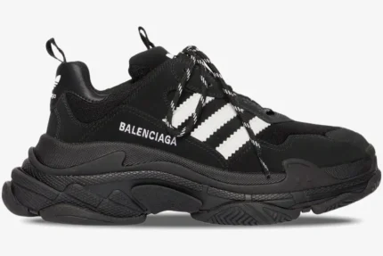Side profile of a black and white Balenciaga Triple S x Adidas sneaker with chunky soles. - SKU 712821W2ZB21090