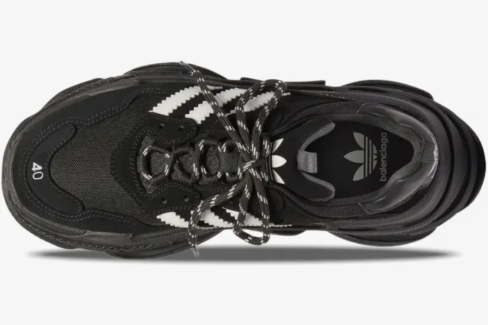 Top-down view of a Balenciaga Triple S x Adidas sneaker in black and white with patterned laces. - SKU 712821W2ZB21090