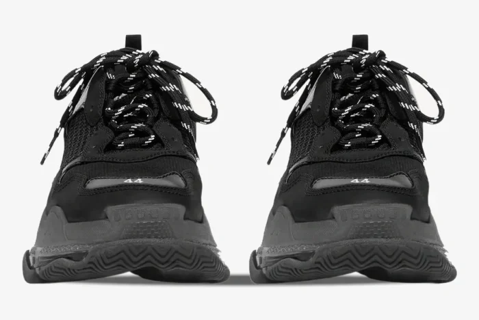 Front view of Balenciaga Triple S Black Clear Sole sneakers with chunky soles and patterned laces. - SKU 541624W2FB11000