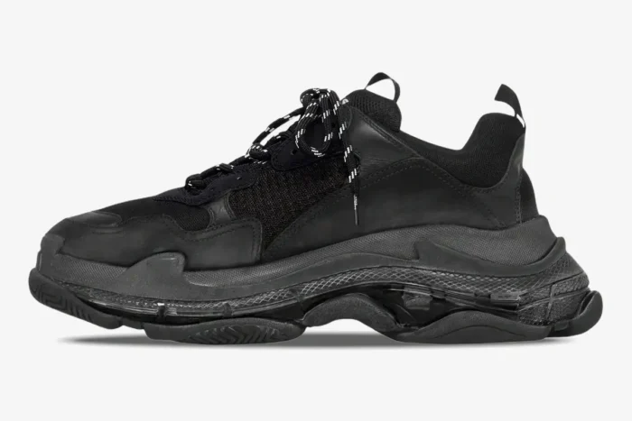 Balenciaga Triple S black clear sole sneakers in a side profile view against a white background. - SKU 541624W09E11000