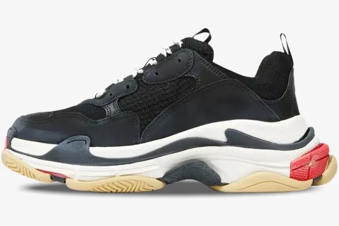 Side profile of a Balenciaga Triple S sneaker in black, white, and red with a chunky multi-layered sole. - SKU 533882W09OM1000
