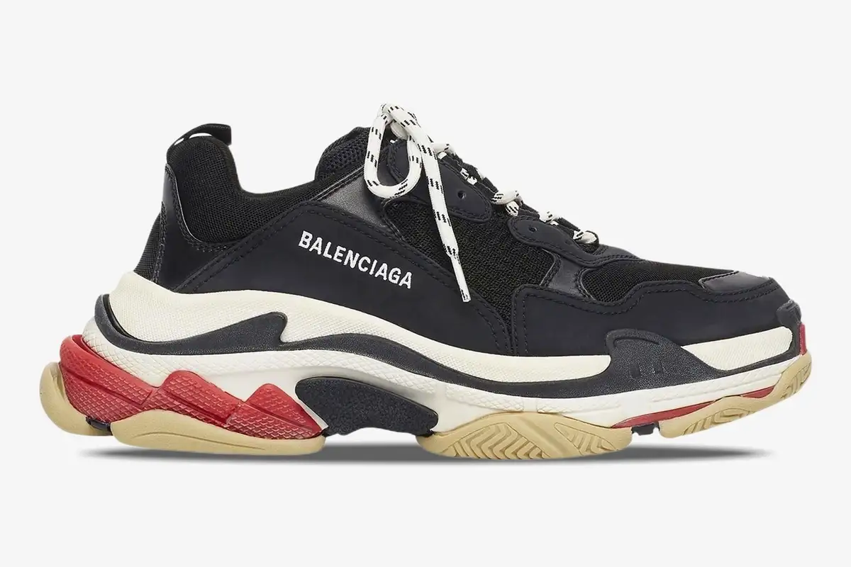 balenciaga-triple-s-black-white-red-side-view-533882w09om1000-850-849 Side profile view of Balenciaga Triple S sneakers in black, white, and red with chunky soles. - SKU 533882W09OM1000