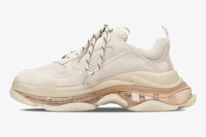 Side profile of a Balenciaga Triple S Clear Sole Sneaker in off-white and cream. - SKU 541624W2FB19005