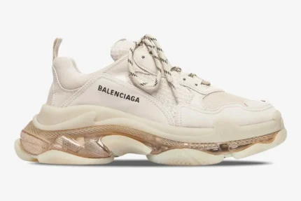 Balenciaga Triple S Clear Sole Sneaker in off-white, side profile view showing chunky layered sole. - SKU 541624W2FB19005