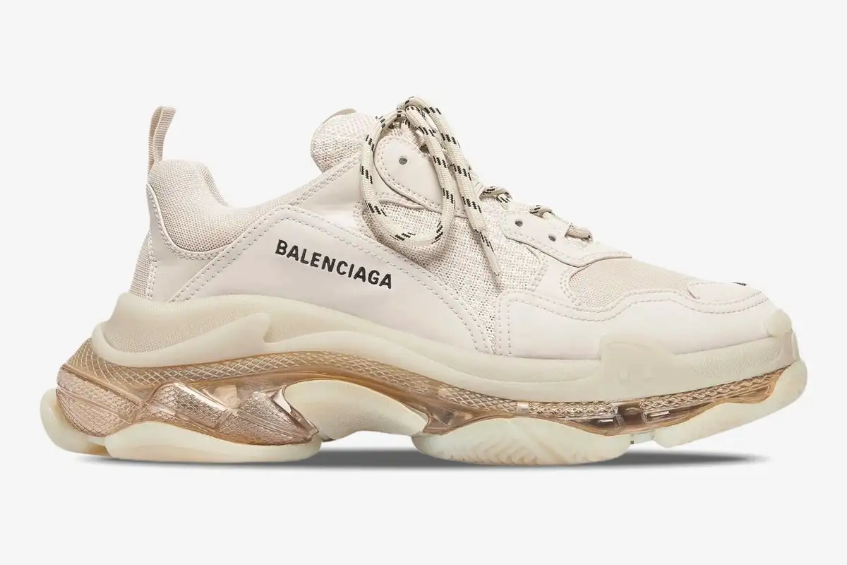 balenciaga-triple-s-clear-sole-off-white-side-541624w2fb19005-578-144 Balenciaga Triple S Clear Sole Sneaker in off-white, side profile view showing chunky layered sole. - SKU 541624W2FB19005