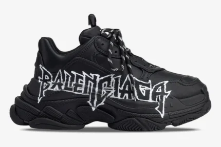 Side view of a black Balenciaga Triple S sneaker featuring white DIY metal-style graffiti artwork on the side. - SKU 536737W2FAY1090