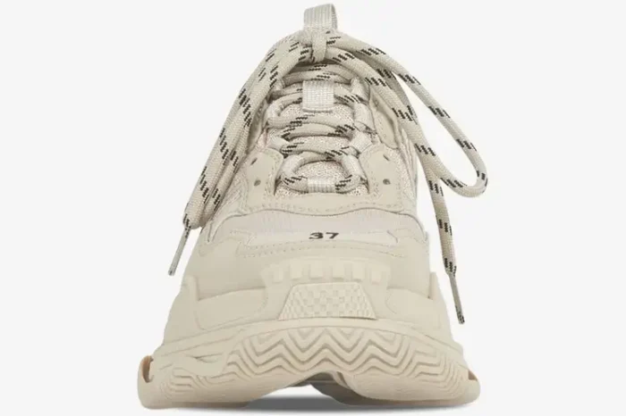 Front view of a beige Balenciaga Triple S chunky sneaker with patterned laces. - SKU 524039W2FW19700