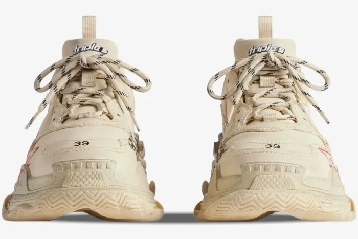 Front view of Balenciaga Triple S Graffiti sneakers in beige and red with size 39 on the toe. - SKU 524039W2FA19010