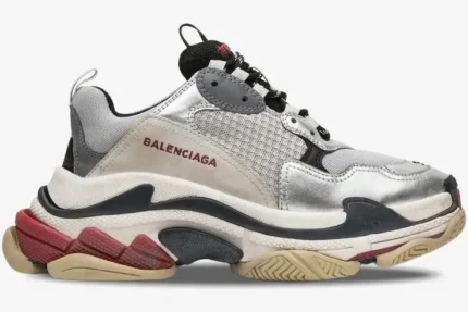Balenciaga Triple S Silver Black Metallic sneaker in a side profile view with chunky multi-layered sole. - SKU 524039W09O68165