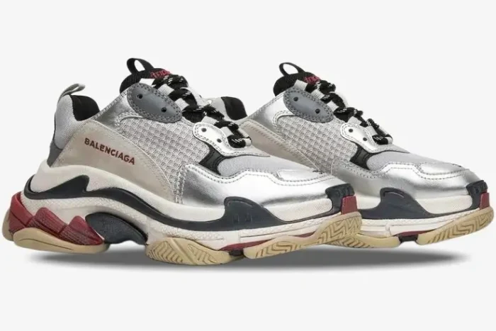 Side view of Balenciaga Triple S Silver Black Metallic chunky sneakers with multi-layered soles. - SKU 524039W09O68165
