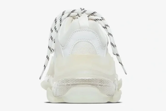 Rear view of white Balenciaga Triple S sneakers featuring a chunky clear sole and patterned laces. - SKU 544351W2FB19000