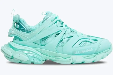 Side profile of a Balenciaga Women's Track Sneaker in mint green featuring a chunky, layered design. - SKU 542436W2LA13000