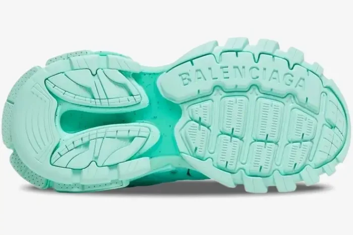 Bottom sole view of a Balenciaga Wmns Track Sneaker in mint green, showing the chunky tread pattern and logo. - SKU 542436W2LA13000