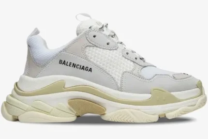 Side profile of Balenciaga Women's Triple S Trainer in white and cream with a chunky layered sole. - SKU 524036W09E19000