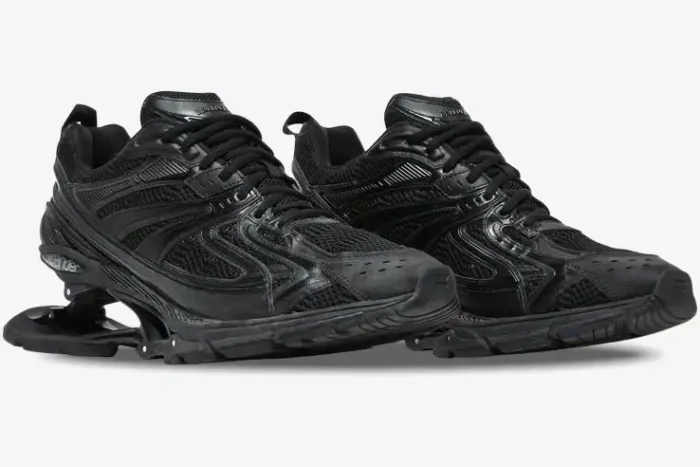 Pair of black Balenciaga X-Pander distressed sneakers with suspended heels, three-quarter front view. - SKU 653871W2RA21000