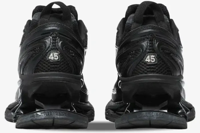 Rear view of black Balenciaga X-Pander sneakers featuring distressed details and suspended heels. - SKU 653871W2RA21000