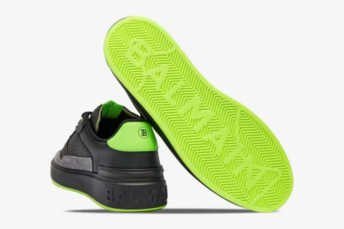 Rear view of Balmain B-Court black and neon green sneakers showing heel logo and bright green sole. - SKU AM1VI289LSYM