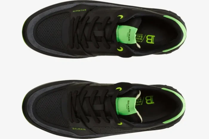 Top-down view of Balmain B-Court low-top sneakers in black leather with vibrant neon green accents and logos. - SKU AM1VI289LSYM