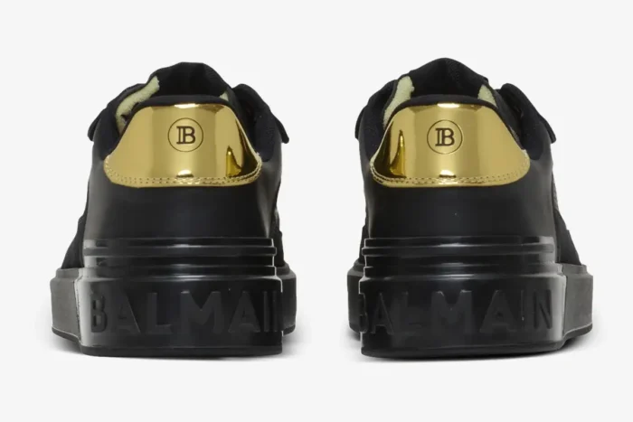 Rear view of Balmain B-Court Flip low-top sneakers in black with gold metallic heel tabs. - SKU DN0VI727LBSO