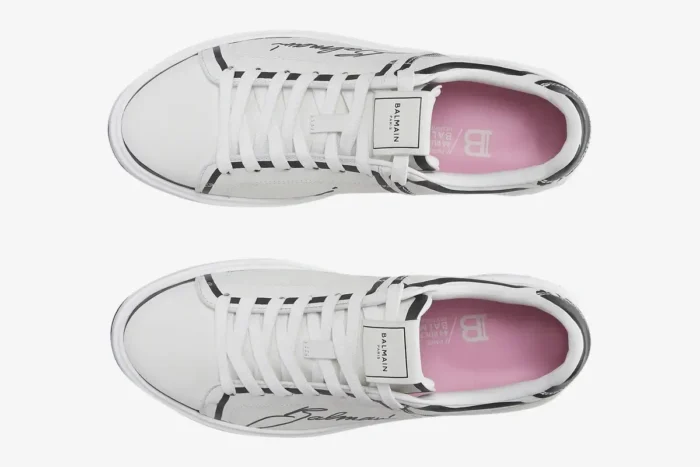 Top-down view of Balmain B-Court white calfskin low-top sneakers with black script logo and pink insoles. - SKU EN1VI690LCLP