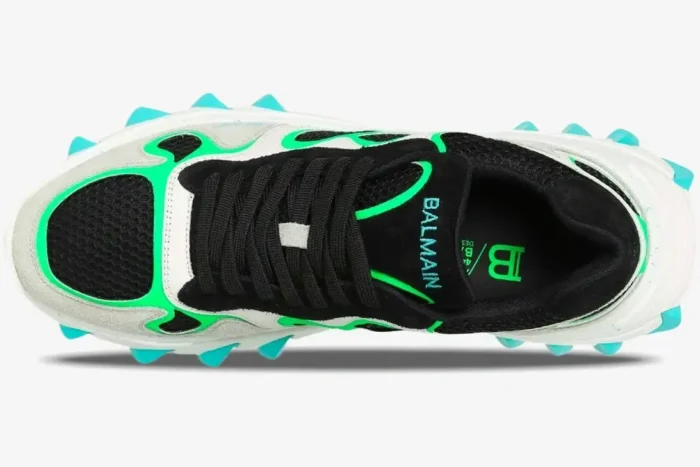 Top view of Balmain B-East sneakers featuring black mesh, neon green accents, and turquoise spikes. - SKU AM1VI327THTF