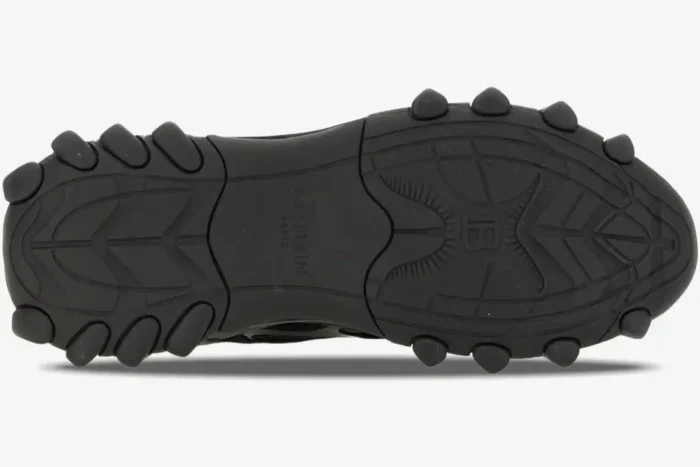 Bottom view of the black Balmain B-East Low Top sneaker sole showing tread pattern and logo. - SKU AM1VI327THPC-0PA