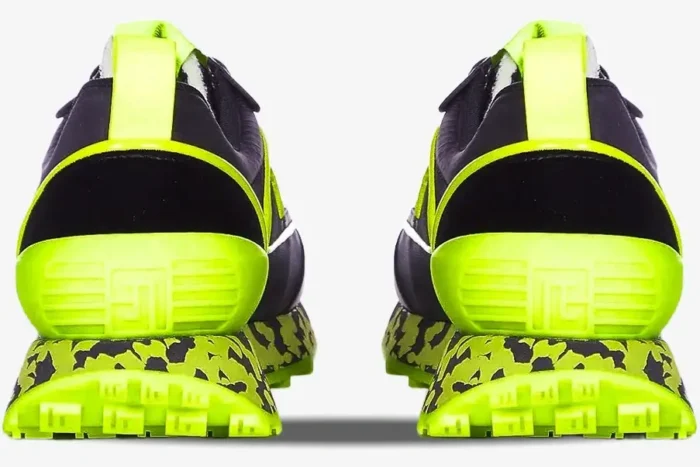 Rear view of Balmain B-Racer sneakers in black and neon yellow with a marbled midsole and textured heel. - SKU ym1vi305tvnh