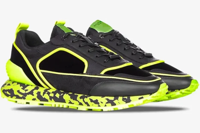 Balmain B-Racer sneakers in black and neon yellow with a marbled midsole, side profile view. - SKU ym1vi305tvnh