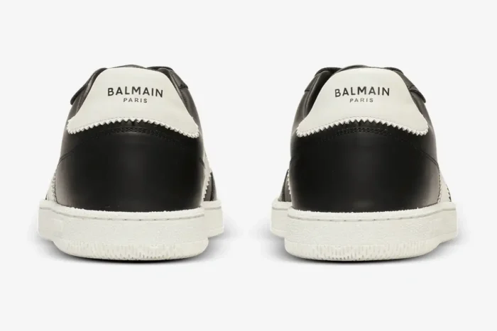 Rear view of Balmain Calfskin Swan Trainers in black and white with logo heel tabs. - SKU EM0VI360LVTR