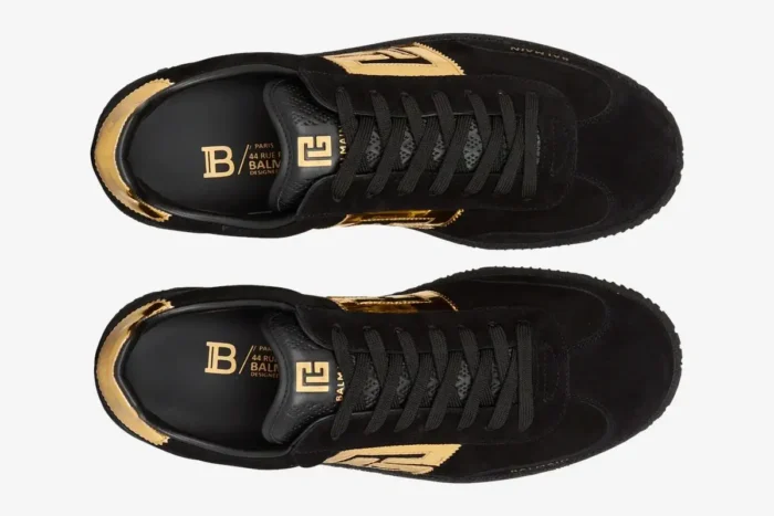 Top-down view of Balmain Swan black goatskin suede sneakers with gold accents. - SKU AM1VI261LSGG