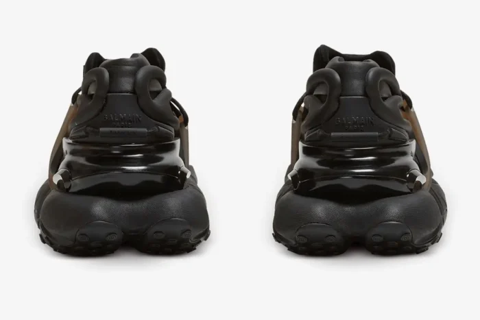 Rear view of Balmain Unicorn chunky sneakers in all black, showing the textured heel and logo. - SKU BM1VJ309KNSC