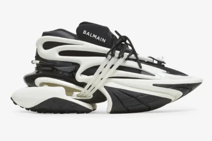 Balmain Unicorn chunky sneakers in black and white, side profile view on a white background. - SKU BN1VF724KNOC