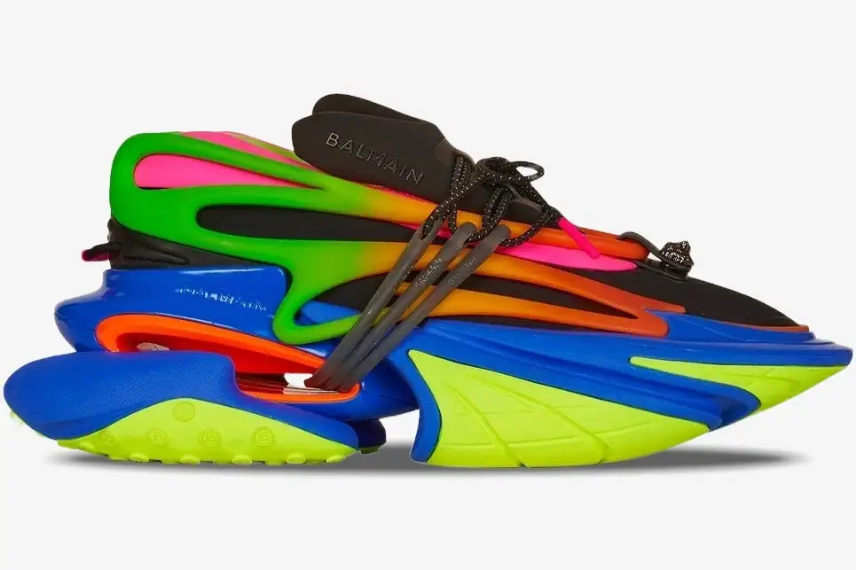 balmain-unicorn-low-multicolor-black-side-view-ym1vj309knhc-214-801 Balmain Unicorn Low Multicolor Black sneaker in a side view with neon green, pink, and blue layered design. - SKU YM1VJ309KNHC