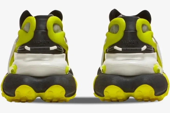 Back view of Balmain Unicorn low-top sneakers in black and neon yellow with chunky soles. - SKU YM0VJ309KNET