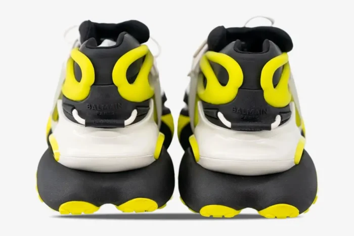Rear view of Balmain Unicorn low-top sneakers in black, white, and neon yellow. - SKU YM0VJ309KNET