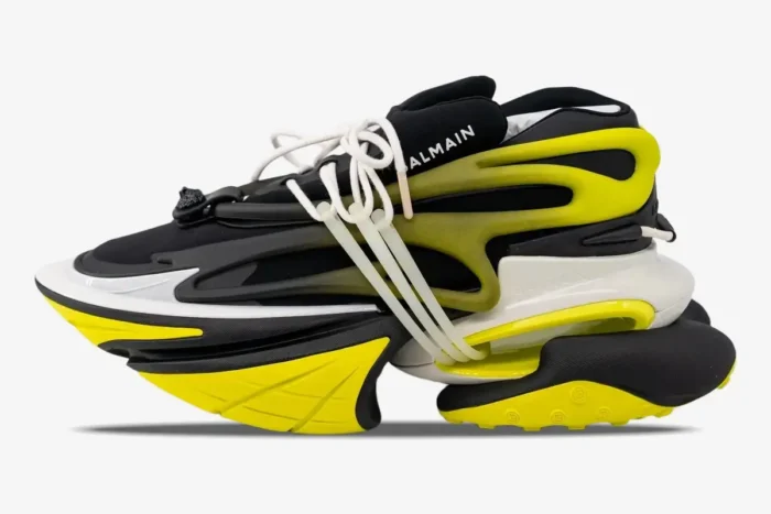 Side profile of Balmain Unicorn Low-Top sneakers in black and neon yellow with a chunky futuristic sole. - SKU YM0VJ309KNET