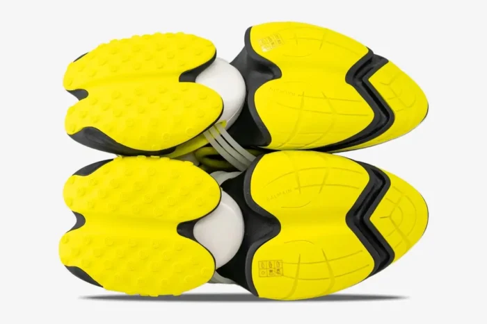 Bottom view of Balmain Unicorn Low-Top sneakers in black and yellow showing the unique tread pattern. - SKU YM0VJ309KNET