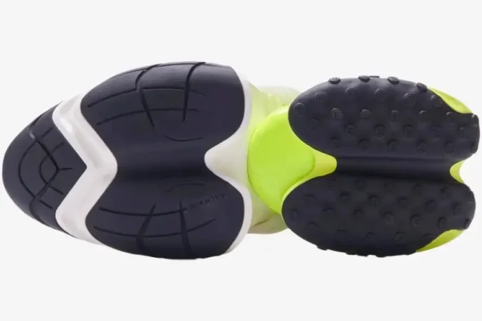 Bottom view of Balmain Unicorn sneakers in white and neon yellow showing the black segmented outsole. - SKU AM0VI294LNSB