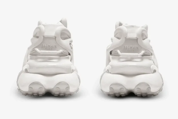 Rear view of white Balmain Unicorn low-top sneakers in neoprene and leather with chunky sculpted soles. - SKU AM0VJ309KNLR