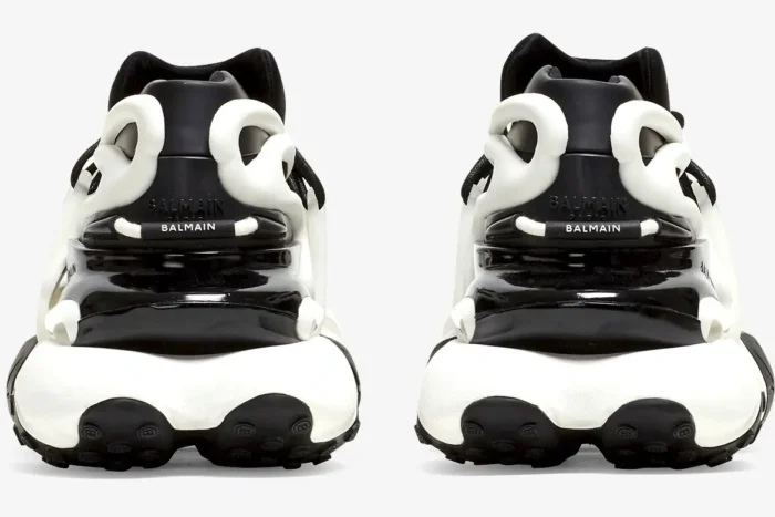 Rear view of Balmain Unicorn chunky sneakers in black and white with thick sculpted soles. - SKU BN1VF724KNOC
