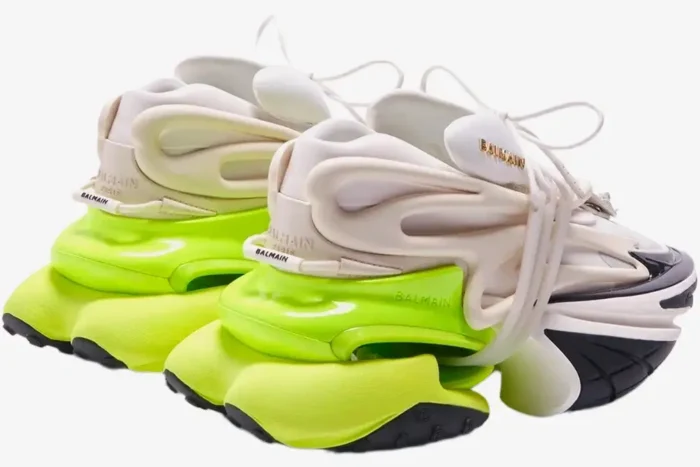 Rear view of Balmain Unicorn low-top sneakers in white and neon yellow with chunky futuristic soles. - SKU AM0VI294LNSB