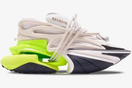 Side view of Balmain Unicorn low top sneakers in white and neon yellow with black accents. - SKU AM0VI294LNSB